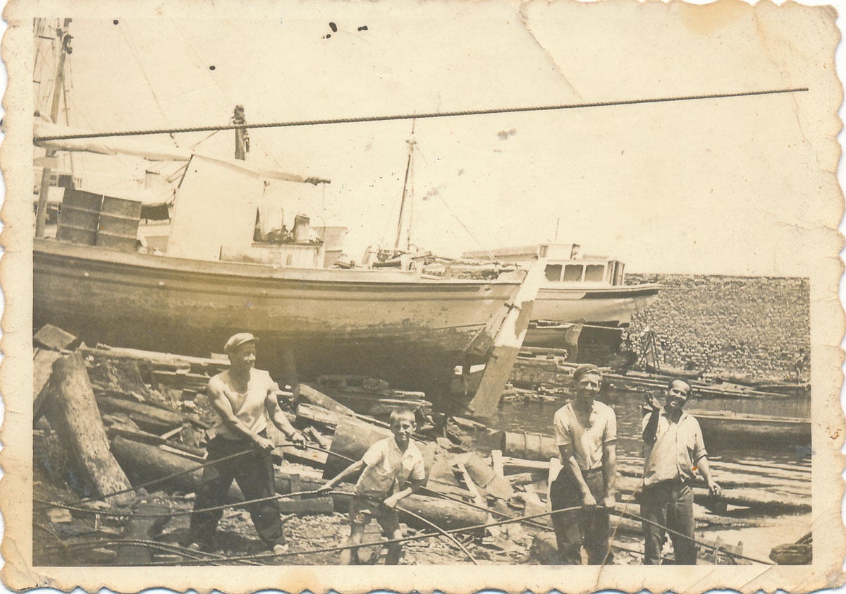Dimitris Polidoulis and a crew hauling boat
