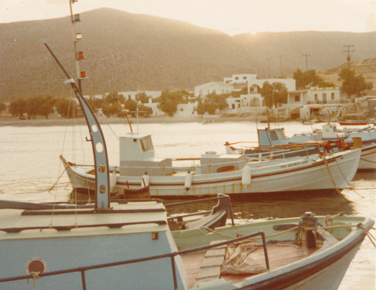 Traditional fishing boats docked in Cycladic port