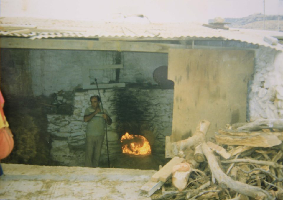 Nikos Exylzes preparing wood fired kiln in Platys Gialos, c. 1980. 